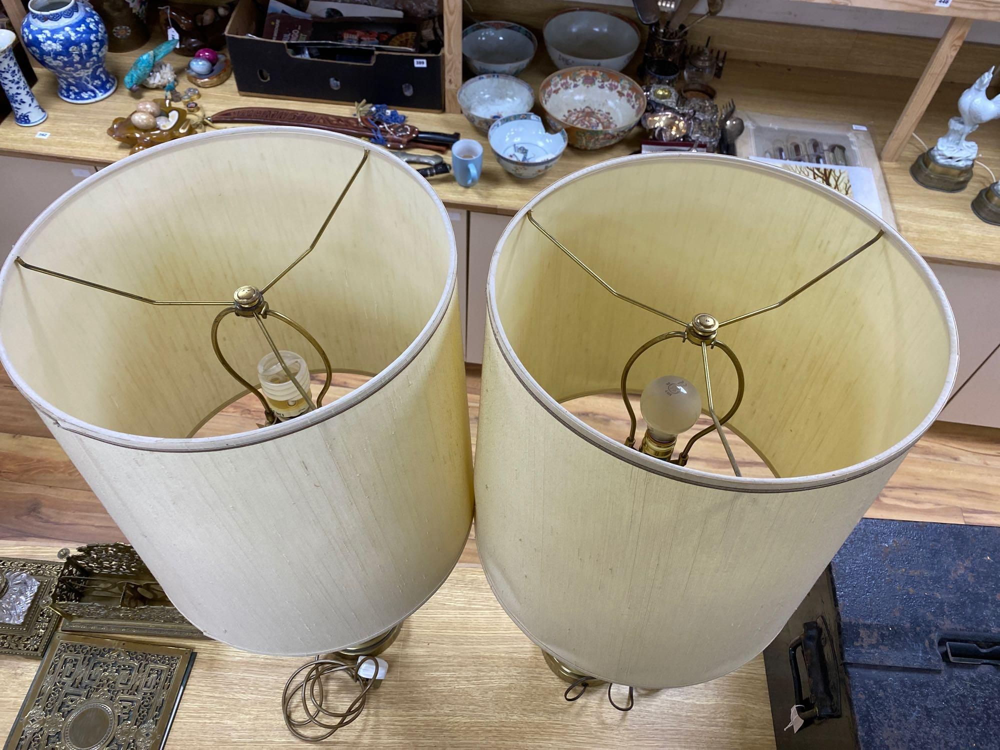 A pair of Art Nouveau style brass lamps, total height 67cm